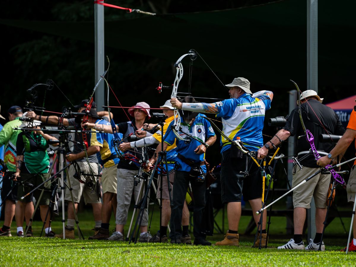 Masters drawing their bowstrings aiming for target