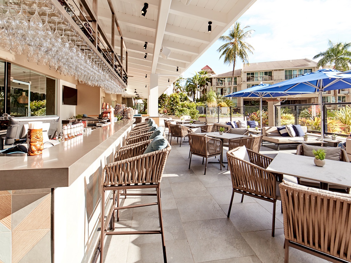 Novotel Oasis bar is depicted, showcasing contemporary furnishings and vibrant decor, creating a lively atmosphere